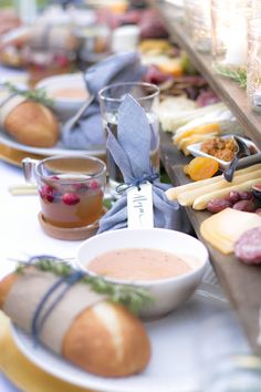 an assortment of food is on display at a buffet table