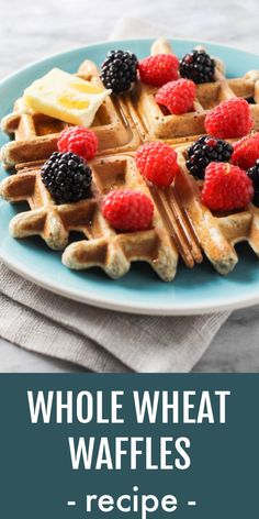 whole wheat waffles with raspberries and bananas on top are served on a blue plate