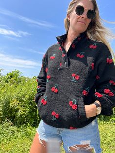 This High Neck Cherry fleece top is an oversized, long-sleeve statement piece that won't let you go unnoticed. Half button-up and full of bright colors, you won't have to worry about blending in. Bring out your inner wild side in this super cozy sherpa top while staying cozy and warm. Fabulously fierce! (100% Polyester) Trendy Fleece Sweater, Black Fleece Tops For Spring, Trendy Black Top With Comfortable Fit, Black Fleece Sweater For Fall, Black Fleece Top For Spring, Trendy Black Cozy Fit Top, Fleece Tops With Letter Print, Cozy Fleece Tops With Letter Print, Cozy Black Fleece Top