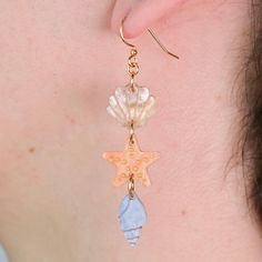 When I was a kid exploring tidepools was one of my favorite things to do, I couldn't get enough of the adorable little worlds that lived between and under the rocks. This pair is an ode to my love for all things shells, starfish, and ocean critters! Affordable Starfish Charm Earrings For Gifts, Cheap Novelty Jewelry For Beach, Cheap Novelty Beach Jewelry, Handmade Ocean-inspired Earrings, Tentical Earrings, Kikay Earrings, To My Love, Kids Exploring, Beach Combing