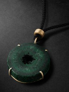 Jacquie Aiche carefully selects gemstones for their unique properties, the designer calls each piece of jewellery a "talisman of energy". This cord necklace is strung with a slice of malachite, a protective stone that's thought to clear negativity, in a gold prong setting. Spiritual Malachite Jewelry With Natural Stones, Artisan Malachite Jewelry With Natural Stones, Artisan Jewelry With Natural Malachite Stones, Spiritual Malachite Pendant Necklace, Luxury Large Stone Pendant Jewelry, Luxury Malachite Necklaces For Gifts, Artisan Malachite Gemstone Jewelry, Emerald Amulet Pendant Jewelry, Luxury Agate Jewelry Gift