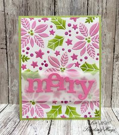 a card with the word merry written on it and some flowers in pink, green and white