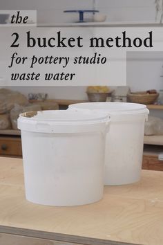 two buckets sitting on top of a wooden table next to each other with the words 2 bucket method for pottery studio waste water