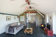 a living room filled with furniture and a fire place