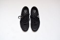 Vintage black canvas and rubber lace up sneakers in excellent condition. Brand Le Coq Sportif Size 37 (us 5, uk 4, jpn 23.5) Made in Thailand Canvas uppers Rubber sole and toes Laces insole 23.5 cm = 9.3 in ball width 7.5 cm = 3 in Black Cotton Canvas Sports Shoes, Black Urban Cotton Skate Shoes, Black Cotton Canvas Shoes For Sports, Black Lace-up Cotton Skate Shoes, Black Lace-up Canvas Shoes With Rubber Waffle Outsoles, Black Canvas Sports Shoes, Black Canvas Shoes With Rubber Toe Cap For Sports, Black Sporty Canvas Shoes With Gum Sole, Sporty Black Canvas Shoes With Gum Sole