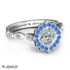 a blue and white diamond engagement ring with the words forever and always engraved on it