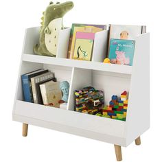 a white book shelf with books and toys on it's sides, against a white background