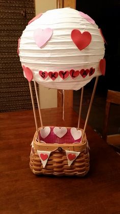 a hot air balloon with hearts on it