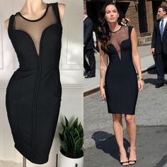 a woman in a black dress next to a mannequin