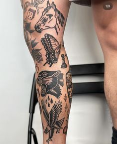 a man's leg with tattoos on it and an eagle in the middle is shown