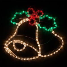 a lighted christmas bell on a black background with red, green and white lights around it