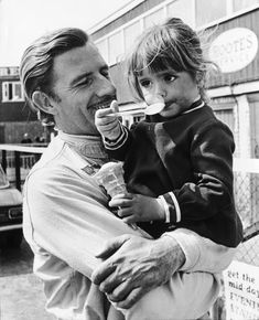 Silverstone, England. 25th April 1968. Graham Hill (Lotus 49-Cosworth), retired, with his 3 year old daughter Samantha, portrait. World Copyright: David Hudson/LAT Photographic. Ref: DH - 68INT - Neg14A-15 Graham Parkhurst, Father Paul Hill, Samantha Portrait, Paul Graham Photography, Heather Graham Movies, Lotus 49