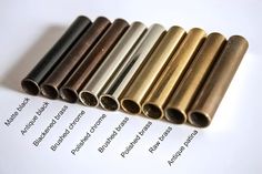 several different types of metal tubes lined up on top of each other