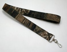 the lanyard strap is made from realtree camo and has a metal hook