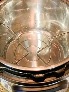 a metal bowl sitting on top of a counter