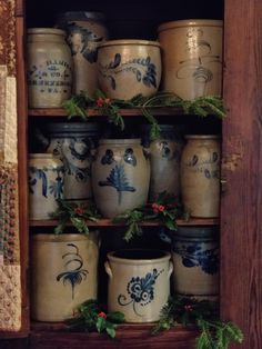 an old wooden box filled with ceramic pots