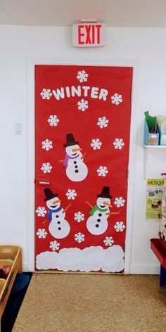 a classroom door decorated with snowmen and the words winter