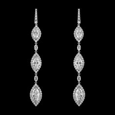 CZ Drop Earrings in Silver Add a glamorous touch to your special day with this stunning cz earrings. These dazzling Cubic Zirconia statement earrings will be an elegant addition to your wedding day, prom or pageant! These silver plated drop cz earrings feature dazzling AAA quality CZ crystals in a beautiful drop design. Size: 3.45" long. Color: Silver. Style: EME4432. Need several pair of earrings for your bridal party or damas? You can buy in bulk and save. Please allow 1 week for delivery. Shipping Policy . Return Policy. Winter Wedding Accessories, Drop Bridal Earrings, Gold Bridesmaid Jewelry, Pendulum Earrings, Silver Bridal Earrings, Formal Earrings, Bridesmaid Pearls, Bridal Earrings Drop, Prom Earrings