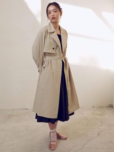 This is a belted trench coat with a clean, three-dimensional silhouette. The sophisticated semi-overfit silhouette and volume sleeve details create a slim body line. Made of cotton and nylon blend material with a luxurious appearance and soft feel. It is a trendy item that has an attractive casual yet feminine mood and will complete a stylish coordination with a variety of outfits.- Pockets on both sides for practical use- Belt allows you to create the silhouette you want- Can be worn comfortably with slightly dropped shoulders- Formal yet casual mood item*The color of the product may differ from the actual color depending on the monitor resolution. Belted Beige Cotton Outerwear, Belted Trench Coat, Of Outfits, Feel It, Sleeve Detail, Three Dimensional, Trench Coat, Jackets & Coats, Resolution