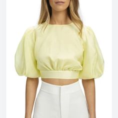 Voluminous Elbow-Length Sleeves Perfectly Frame This Organza Crop Top Featuring Sweet Cutout At The Side Waist. Bardot Enya Organza Top In Yellow. - Size 8 (True To Size). Hidden Side Zipper Closure. Waist Cut-Outs. Puff Sleeves With Cinched Cuffs. Bard-Ws344. 58555tb. Material Self: 100% Polyester, Lining: 100% Cotton Care Instructions Hand Wash Fabric Lightweight Chiffon Closure Hidden Side Zipper Sleeves Puff Sleeves With Cinched Cuffs Cut-Outs Waist Brand: Bardot Color: Sunshine 14 1/2" Leng Organza Top, Bardot Top, Jewel Neck, Elbow Length Sleeve, Cut Outs, Puff Sleeves, Side Zipper, Puff Sleeve, Care Instructions