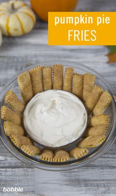 pumpkin pie fries in a glass bowl with whipped cream on top and the words pumpkin pie fries above it