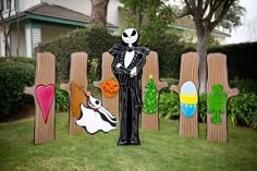 a yard decoration with wooden fence and lawn decorations in the shape of jack skellingy