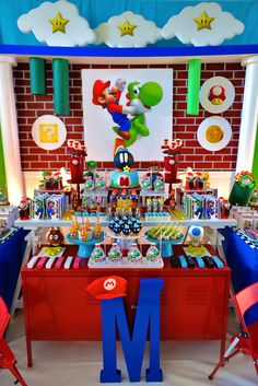 the mario birthday party is set up with decorations and games on display for guests to enjoy