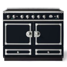 a black stove top oven sitting on top of a white countertop with two burners