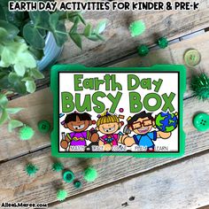 the earth day busy box is surrounded by shamrocks