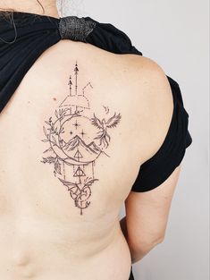 a woman with a tattoo on her back