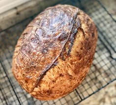 a loaf of bread sitting on top of a cooling rack