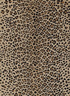 an animal print fabric with black and brown spots