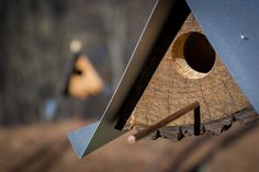 a bird house made out of wood and metal