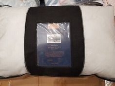 the back side of a pillow that has been wrapped in plastic