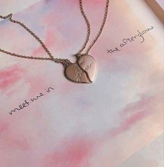 a heart shaped necklace with the words never kiss me before you die written on it