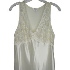 "Vintage 1984 Cinema Etoile Nightgown M White Satin Lace Sleeveless Sheer Back with Tie Brand: Cinema Etoile Made in Philippines Tag Size: Medium 100% Polyester Measurements: Chest: 18\" underarm to underarm Length: 47\" shoulder to hem Pre-owned No defects noted item#0675/021521" Sleeveless Bias Cut Summer Nightgown, Sleeveless Summer Slip Dress For Wedding Night, Sleeveless Slip Dress For Wedding Night In Summer, Sleeveless Lace Trim Slip Dress For Loungewear, Sleeveless Lace Trim Slip Dress For Bedtime, Sleeveless Satin Nightgown, Sleeveless Slip Dress With Lace Trim For Loungewear, Sleeveless Bias Cut Slip Dress For Wedding Night, Sleeveless Slip Dress With Lace Trim For Bedtime