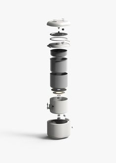 a white object is stacked on top of each other in the shape of a tower