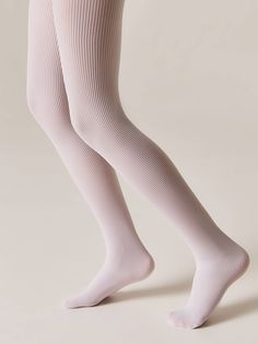 Dense tights made from microfiber yarns feature ribbing that reliably retains warmth, fits comfortably, and remains opaque along the entire length. This model is a perfect match for most items in a child's wardrobe, serving as a stylish addition to both basic and fancy looks. 50 Den Dense and comfortably fitting Ribbed Torso in the form of shorts Comfortable elastic waistband Comfortable flat seam Designed for stylish children's looks in the cooler seasons 95% Polyamide, 5% Elastane Ribbed Tights, Flat Seam, Warm Socks, High Knees, Boutique Homes, Comfortable Flats, Womens Tights, Sock Gifts, Stylish Kids