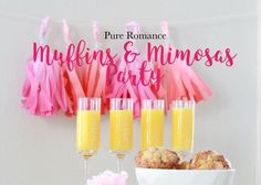 pink and orange desserts with champagne in front of them on a white tablecloth