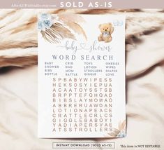 a baby shower word search is displayed on a bed with white fur and blue flowers