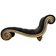 a black and gold chaise lounge chair