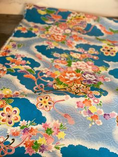 "This beautiful traditional patterned kimono fabric is hand dyed by craftsmen in Kyoto. The company is in business since 1828. The vintage screen is used to paint these beautiful traditional Japanese pattern.  This one has a temari (a small ball for a game), peony, chrysanthemum, pine trees. The colors are exceptionally vibrant, and all the color combinations are so beautifully painted.  The fabric has wonderful texture, a wrinkle-like texture called \"shibo.\" It would be perfect for your tsumami-zaiku project, traditional bag making, ornaments, hair accessories, etc. The fabric can be cut by a half yard. The length of the fabric is 1/2 yard, too. So, the minimum order would be 29\" X 1/2 yard. If you order 2, it would be 29\" X 1 yard. They are imported from Kyoto, Japan. It is 100% rayo Traditional Blue Kimono For Tea Ceremony, Tiny Dresser, Japanese Crepe, Making Ornaments, Japanese Crepes, Tsumami Zaiku, Kimono Fabric, Japanese Patterns, Kyoto Japan