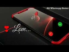 an iphone with the words love on it and two red hearts in front of it