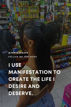 a woman standing in front of a store with her hair pulled back and the words, i use manefestation to create the life i desired and observe