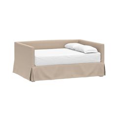 a bed with a white sheet on top of it and a pillow in the middle