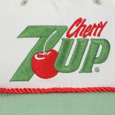 Step back in time with this white 7UP snapback hat, showcasing a retro grandpa shape that exudes vintage charm. The green curved bill perfectly complements the red and green letters spelling out "Cherry 7UP," creating a nostalgic aesthetic. Crafted from ripstop cotton fabric, this hat ensures durability and comfort. The adjustable snapback closure allows for a customized fit, making it suitable for every head size. Hand wash it in cold water and lay it flat to dry for easy care. Elevate your sty Retro Letter Print Baseball Cap, Retro Green Baseball Cap With Curved Bill, Retro Trucker Hat With Embroidered Logo, Green Retro Baseball Cap With Letter Print, Retro Green Baseball Cap With Letter Print, Retro Baseball Cap With Embroidered Logo, White Retro Baseball Cap With Letter Print, Green Retro Hat With Letter Print, Retro Green Hat With Letter Print