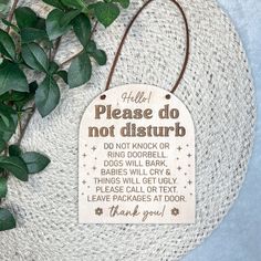 a wooden sign that says please do not disturb