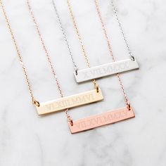 Gold Roman Numeral Necklace! Add a date in roman numerals on the front and a personalized engraving on the back. Gold Bar Necklace Engraved, Roman Numerals Dates, Coordinates Jewelry, Horizontal Bar Necklace, Rose Gold Bar, Engraved Bar Necklace, Vertical Bar Necklace, Silver Bar Necklace, Gold Bar Necklace