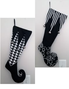 an umbrella is hanging on the wall next to another one with black and white designs