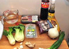 the ingredients are laid out on the table to make this meal, including onions, broccoli, and mushrooms